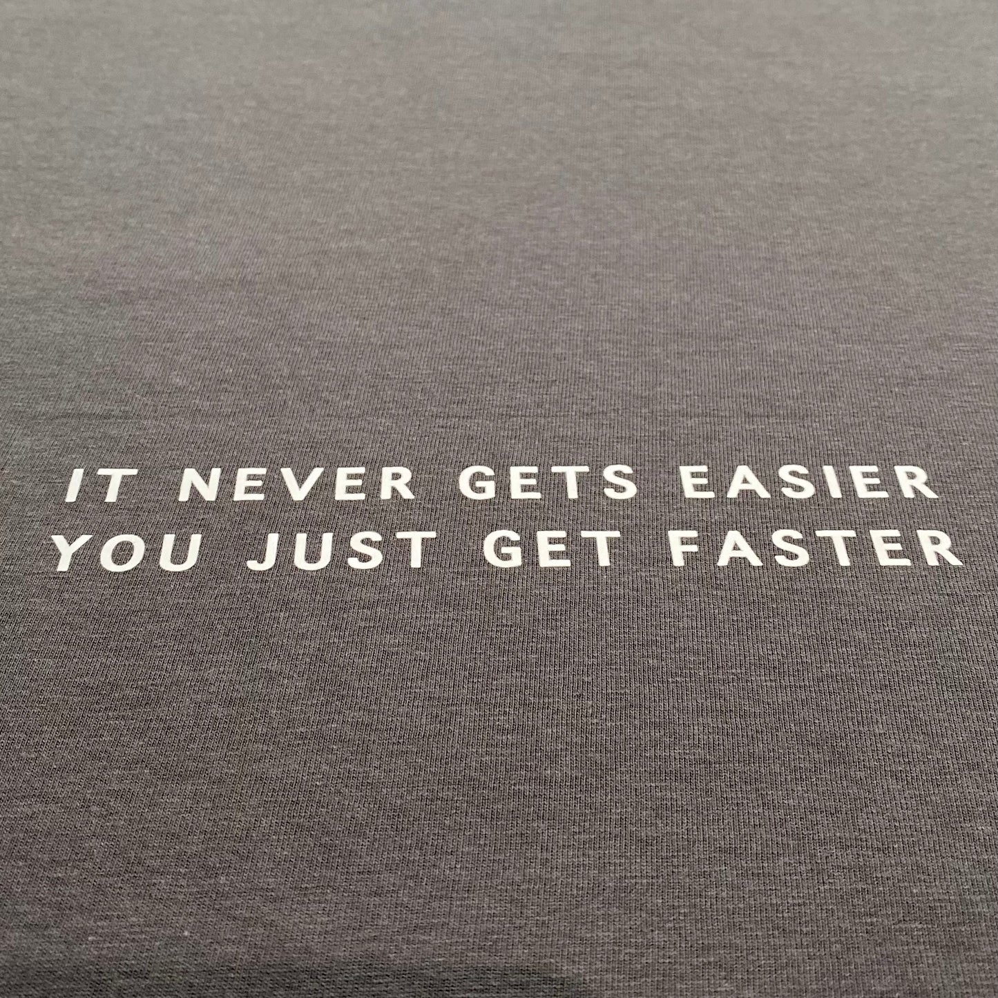 It never gets easier, you just get faster Tee (NEW)
